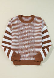 Brown and white geometric stripe knit sweater with a crew neck.