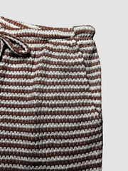 Maternity wide leg trousers in dark brown and white stripe pattern with drawstring waist.