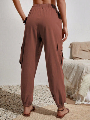 Brown textured cargo lounge trousers with elastic cuffs and side pockets.