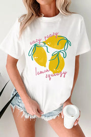 White polyester t-shirt with a cheerful lemon graphic and text that says easy peasy lemon squeezy.