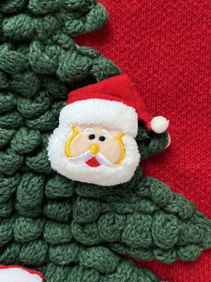 Red knit sweater with green textured Christmas tree and Santa applique detail.