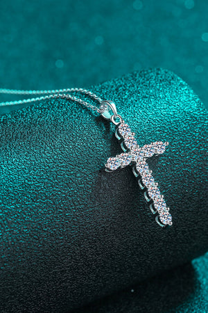Silver pavé diamond cross pendant necklace with a delicate chain.