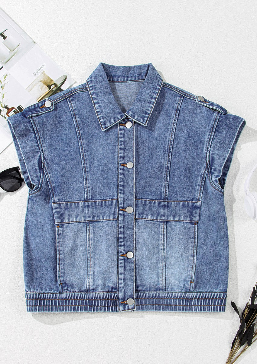 Boxy medium wash denim vest with button front, chest pockets, and shoulder detail.