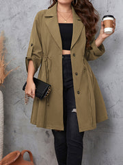 Gathered waistline trench coat in mocha with roll-tab sleeves and tie waist.