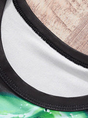 Toddler dinosaur print two-piece set with black trim neckline detail.