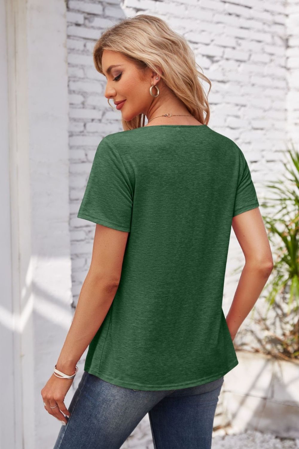Dark green casual short sleeve top with gathered yoke detail.