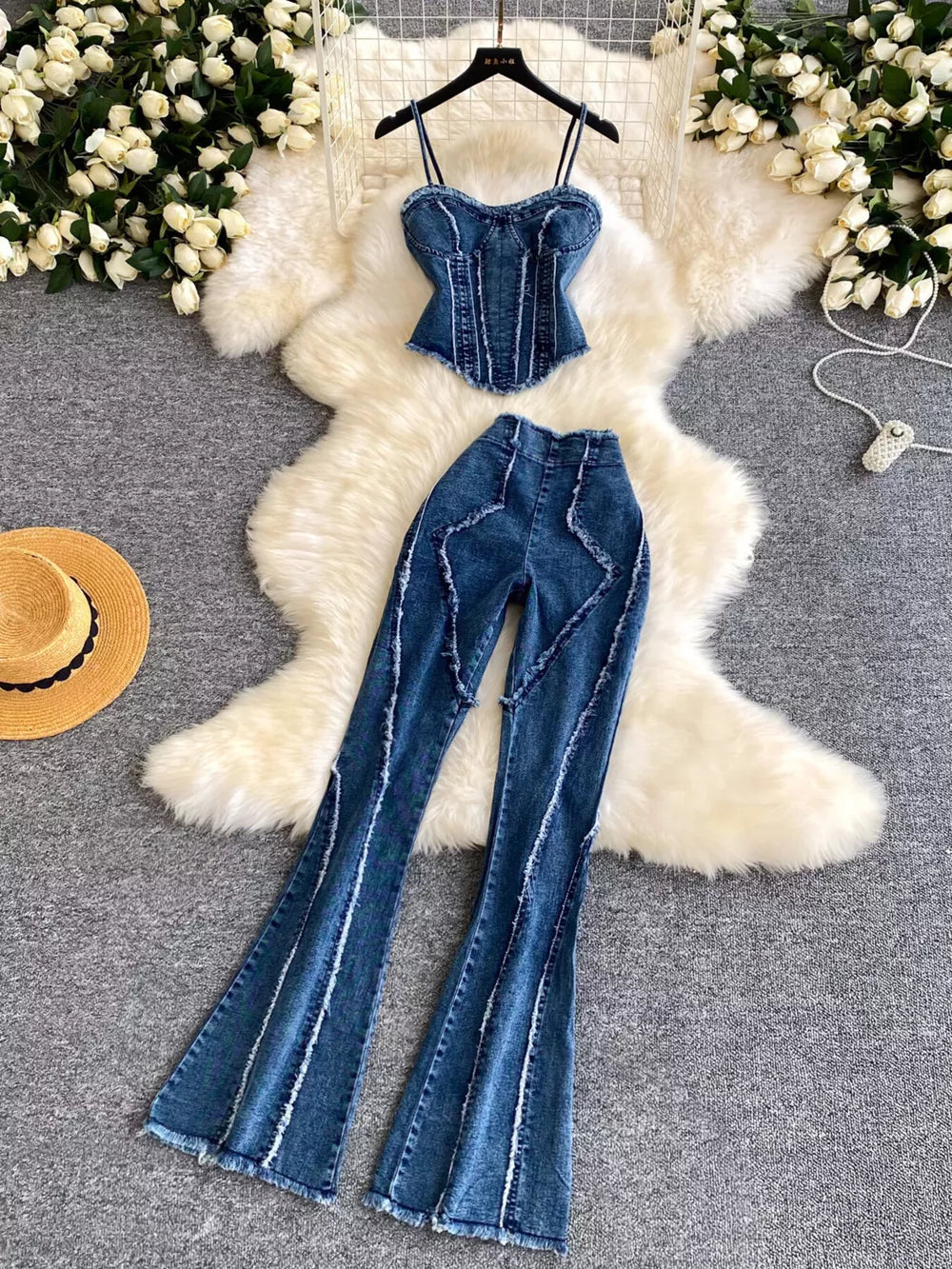 Denim cami and flare pants set with raw hem details and corset-style top.