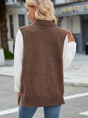 Brown cable knit sweater vest with ribbed collar and hem, worn over a white shirt.