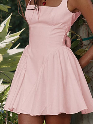 Blush pink backless mini dress with square neckline and bow detail.