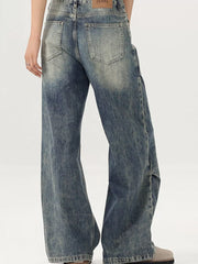 Men's vintage-inspired wide-leg jeans in distressed blue denim with a baggy fit.