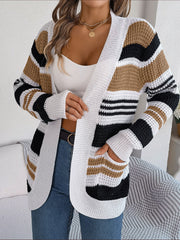 Colorblock open-front knit cardigan with white, black, and taupe stripes and pockets.
