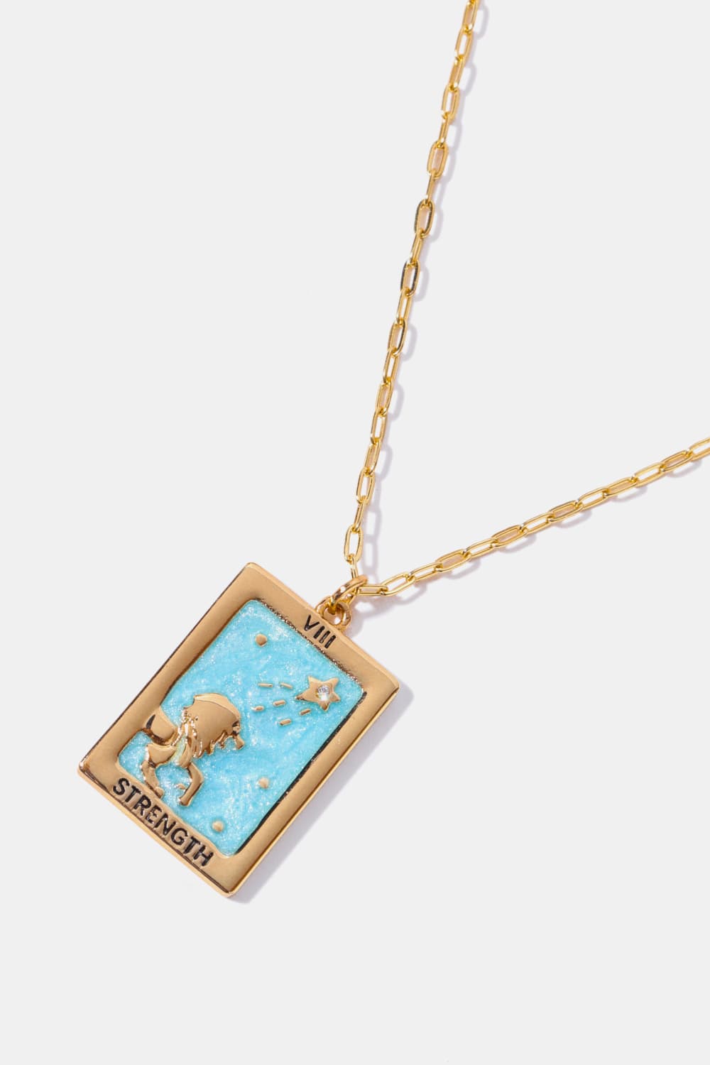 Tarot card pendant necklace with Strength imagery and light blue enamel detail on a gold chain.