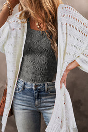 White open-knit dolman sleeve cardigan with a breathable acrylic weave.