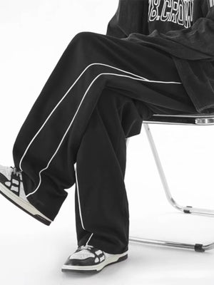 Men's black relaxed fit sweatpants with white side stripes