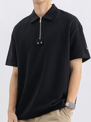 Black cotton polo with half-zip and metallic accents