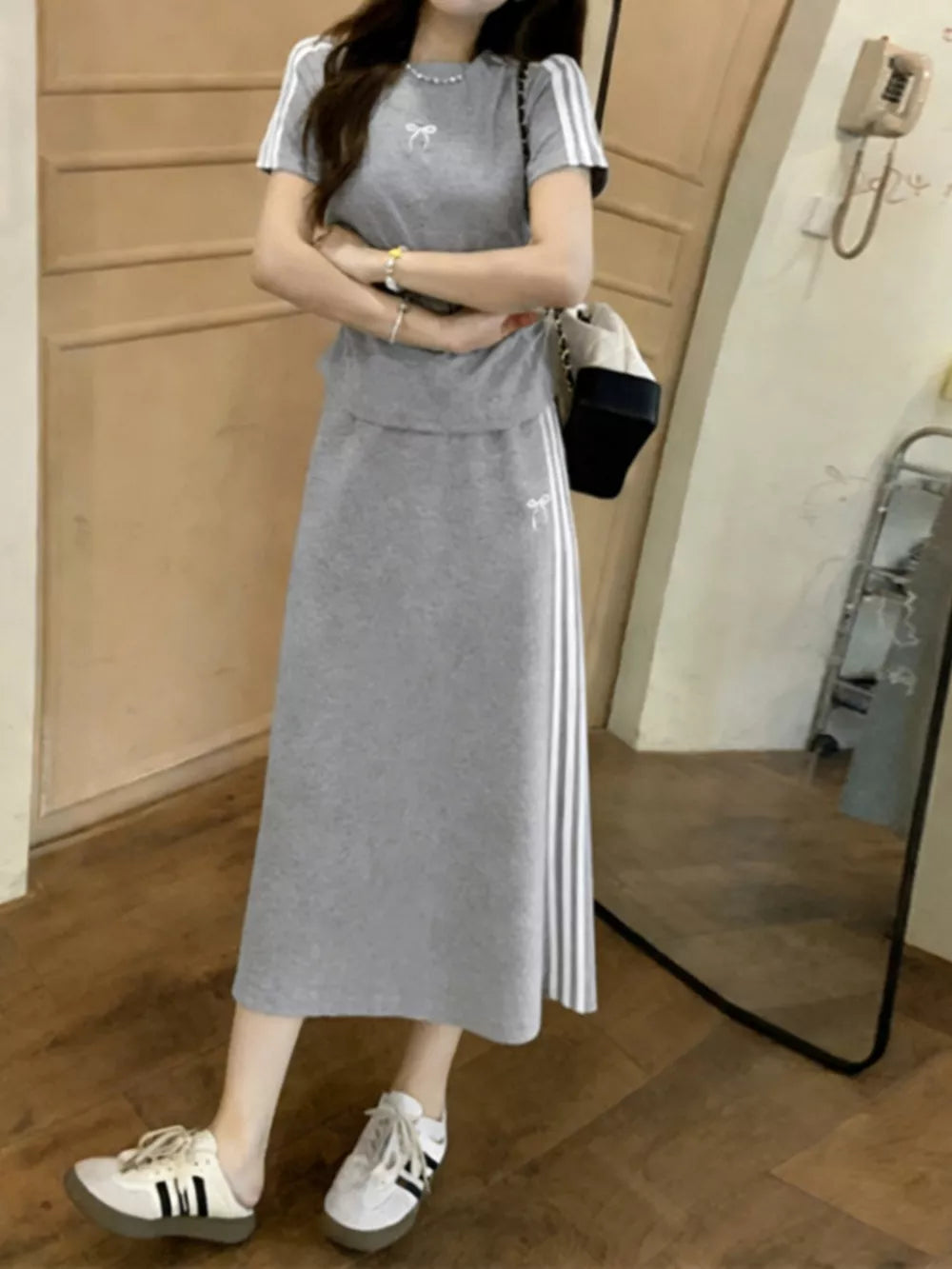 Gray striped tee and midi skirt set with bow detail, casual women's apparel.