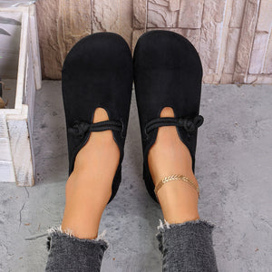 Black matte fabric round toe flats with cord detail and cutouts.