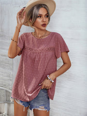 Dusty pink Swiss dot blouse with flutter sleeves and eyelet detail at the yoke.