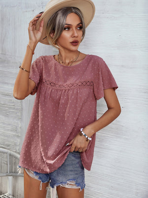 Dusty pink Swiss dot blouse with flutter sleeves and eyelet detail at the yoke.