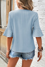 Light blue pleated sleeve V-neck blouse with ribbed texture
