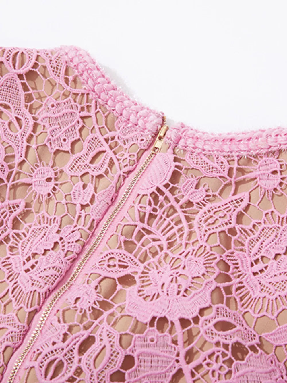 Pink lace midi dress with zipper detail and textured neckline.