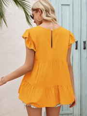 Ruffled yoke babydoll blouse in tangerine with short flutter sleeves and tiered hem.