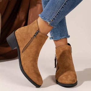 Caramel suede ankle boots with pointed toe and side zipper detail.