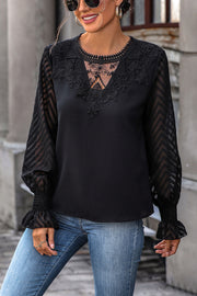 Black lace inset sheer sleeve blouse with V-neck and balloon sleeves.