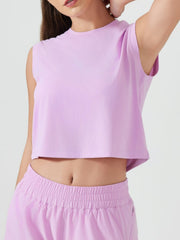 Sculpted crop active muscle tee in Pink Purple, sleeveless with a crew neck.
