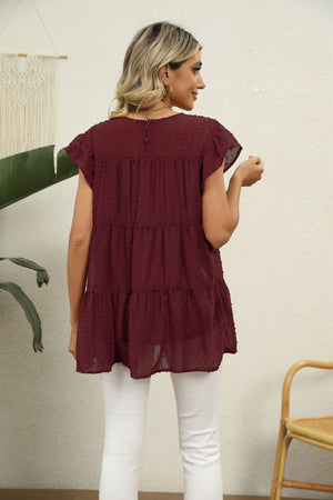 Swiss dot tiered blouse with flutter sleeves in Brick Red.