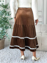 Brown velvet tiered midi skirt with wavy white trim, A-line cut