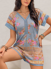 Light blue floral embroidered romper with v-neck and cutout detail