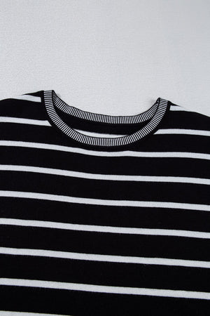 Black and white striped knit tee with contrast ribbed neckline and cuffs.