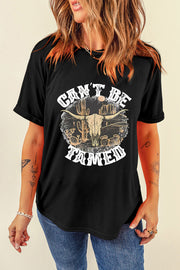 Black cotton blend graphic tee with "Can't Be Tamed" text and bull skull desert scene.