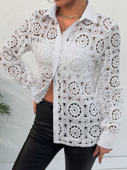 White lace cutout button-up shirt with classic collar and long sleeves.
