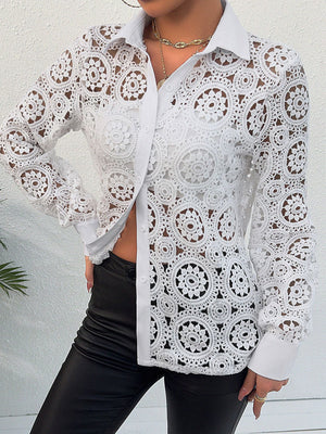 White lace cutout button-up shirt with classic collar and long sleeves.