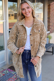 Camel textured corduroy overshirt with faded wash, button front, and chest pockets.