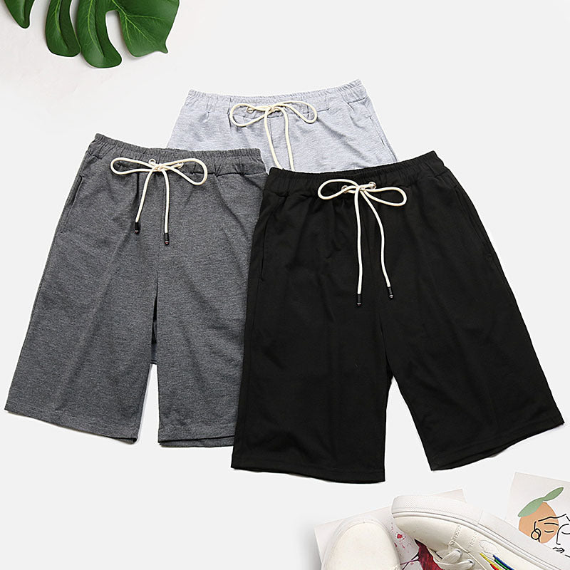 Relaxed culotte lounge shorts in black, grey, and light grey with drawstring waistbands.