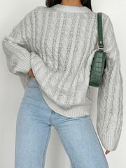 Cable knit openwork sweater in Cloudy Blue acrylic with crewneck and long sleeves.