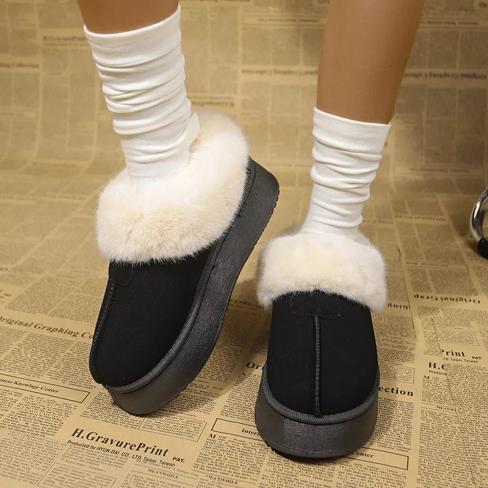Plush suede platform ankle boots in black with cream faux fur trim and white slouch socks.