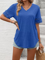 Blue V-neck t-shirt with lace trim on short sleeves.