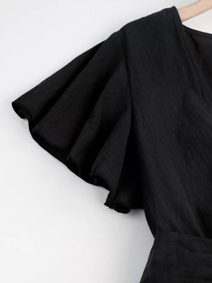 Black flutter sleeve romper with tie waist detail