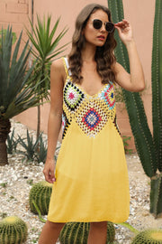 Yellow maxi dress with a colorful crochet yoke and V-neckline.