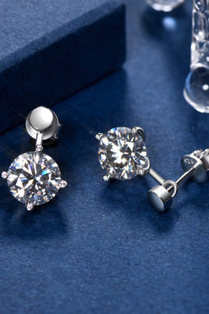 Silver moissanite stud and drop earrings with round-cut stones.
