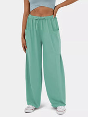 Light Green wide-leg maternity pants with drawstring waist and cargo pockets.