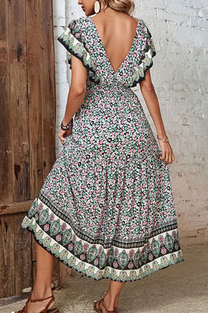 Bohemian floral midi dress with butterfly sleeves, V-neck, and tiered skirt.