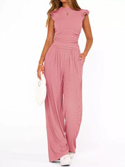 Pink maternity two-piece ensemble with ruffled cap sleeves and wide-leg pants.