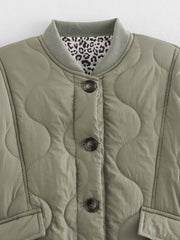 Moss quilted button-down jacket with leopard print lining and ribbed collar.