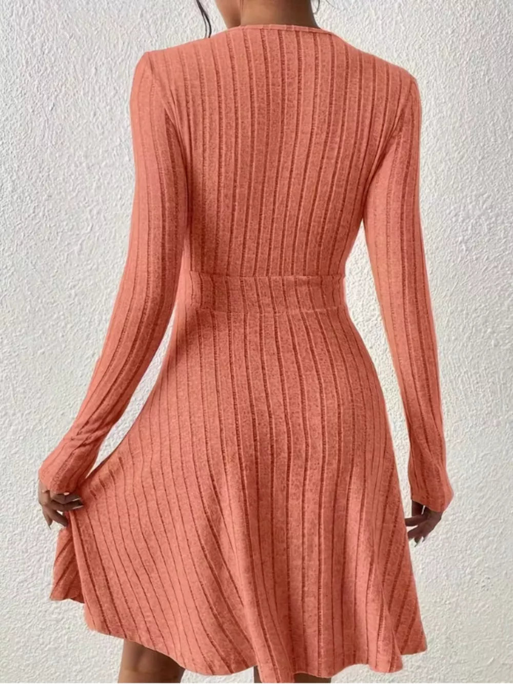 Burnt Coral ribbed texture wrap mini dress with long sleeves and A-line skirt.