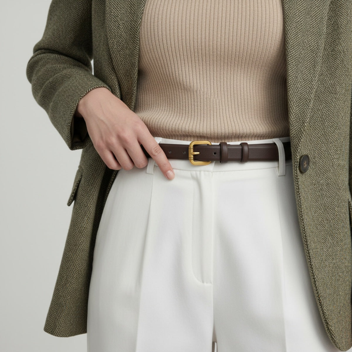 Brown cowhide leather belt with golden buckle, classic casual accessory.